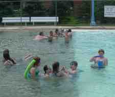 Photo of people enjoying the Lime Springs swimming pool.