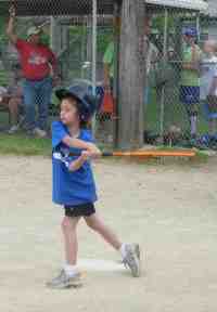 Photo of girl playing softball.